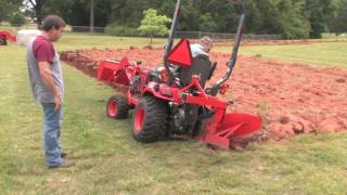 How To Plow With A SubcompactKubota BX Tractor [upl. by Ahseiyk]